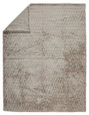 Beige Felldecke mit strukturierter Oberfläche, von oben fotografiert