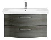 Frontansicht eines modernen Waschtischs mit grauer Holzoptik und zwei Schubladen, ausgestattet mit einem weißen Waschbecken und einem Chrom-Wasserhahn.