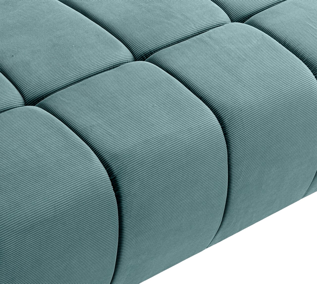 Nahaufnahme eines grünen Schlafsofas mit gestepptem Stoffbezug, seitliche Perspektive