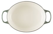 Ovaler Bräter Signature, 31 cm, Draufsicht, cremefarbene Innenfläche mit grünen Griffen.