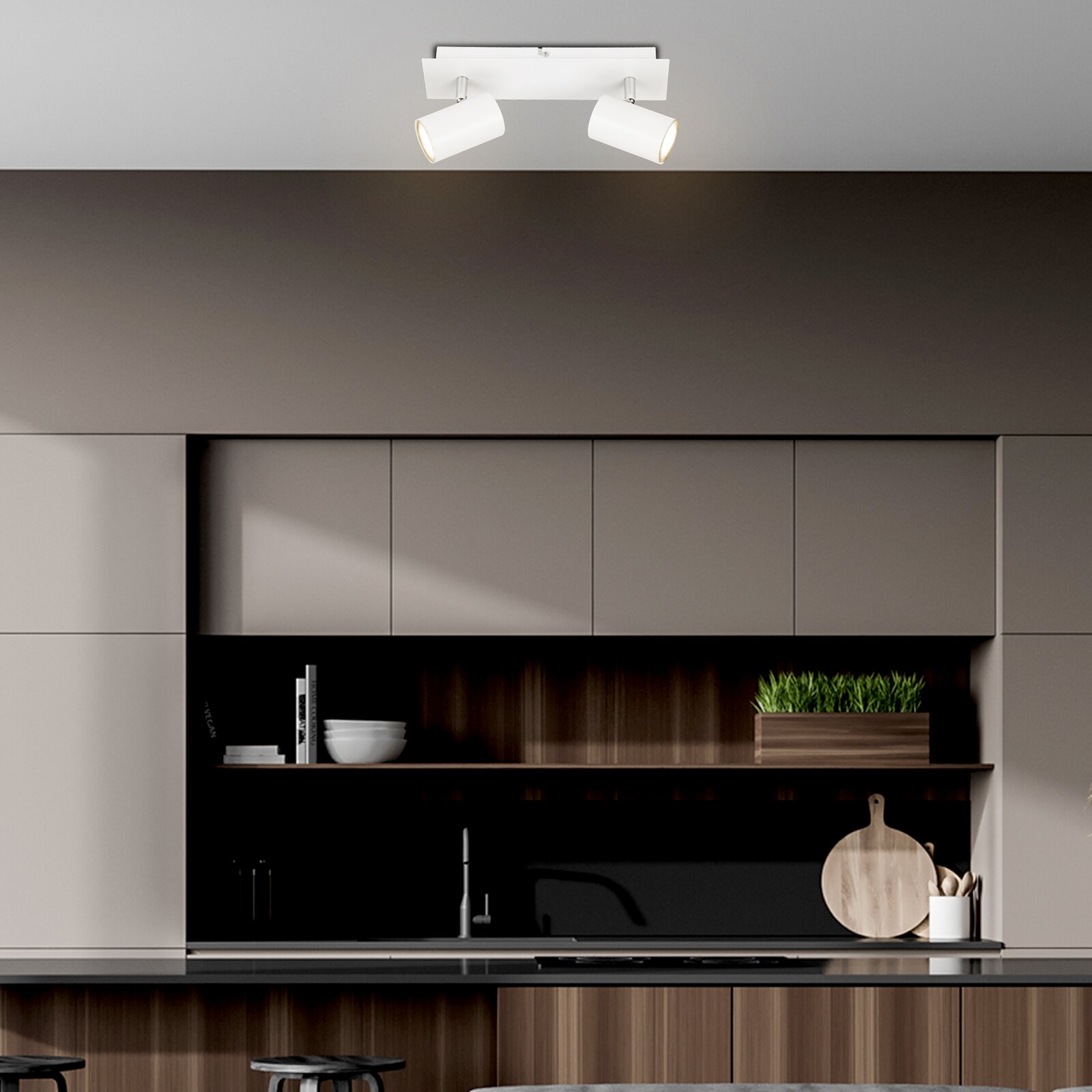 Moderne led-spot met twee verstelbare lampen, gezien vanaf het plafond in een stijlvolle keuken.