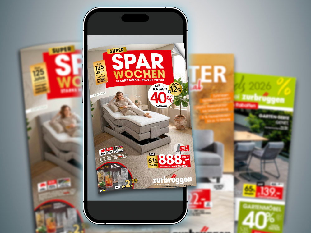 Prospekte der zurbrüggen Super Sparwochen und Smartphone mit digitalem Prospekt vor hellem Hintergrund.