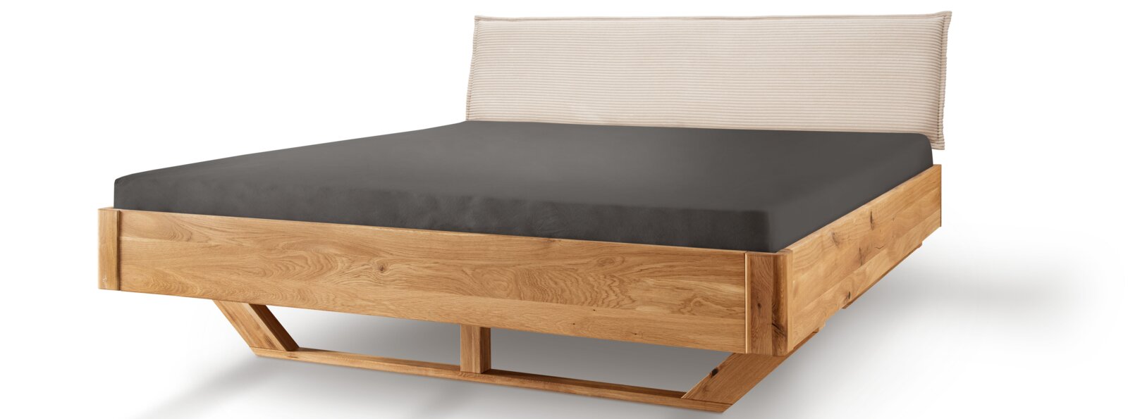 Bedframe van massief licht hout met gestoffeerd hoofdeinde, zijaanzicht