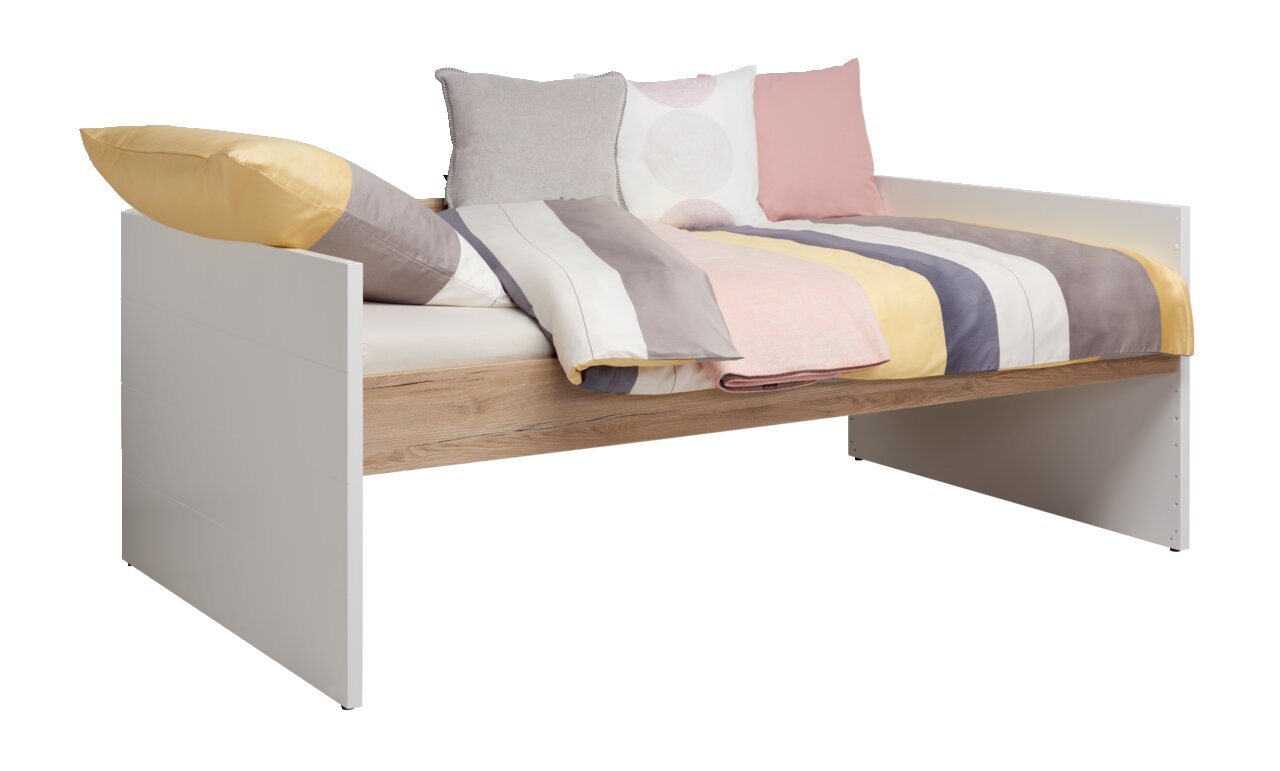 Paidi Kojenbett FIONN Kojenbett mit weißem Rahmen und Holzoptik, dekoriert mit bunten Kissen und gestreifter Bettwäsche, seitliche Perspektive