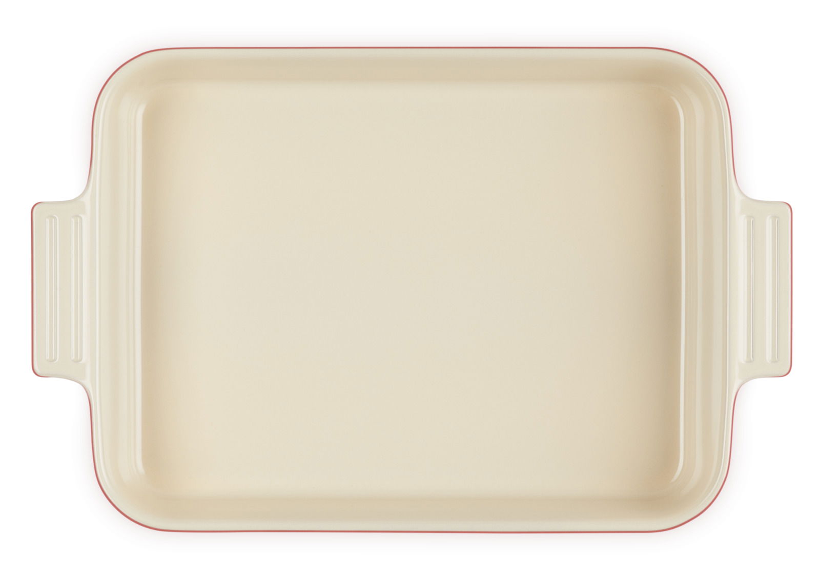 Aufsicht auf eine rechteckige Auflaufform in Kirschrot mit cremefarbener Innenfläche und seitlichen Griffen.