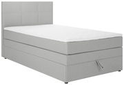 Graues Boxspringbett mit weißer Matratze, seitliche Perspektive
