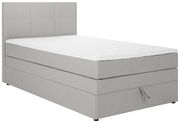 Graues Boxspringbett mit weißer Matratze, seitliche Perspektive