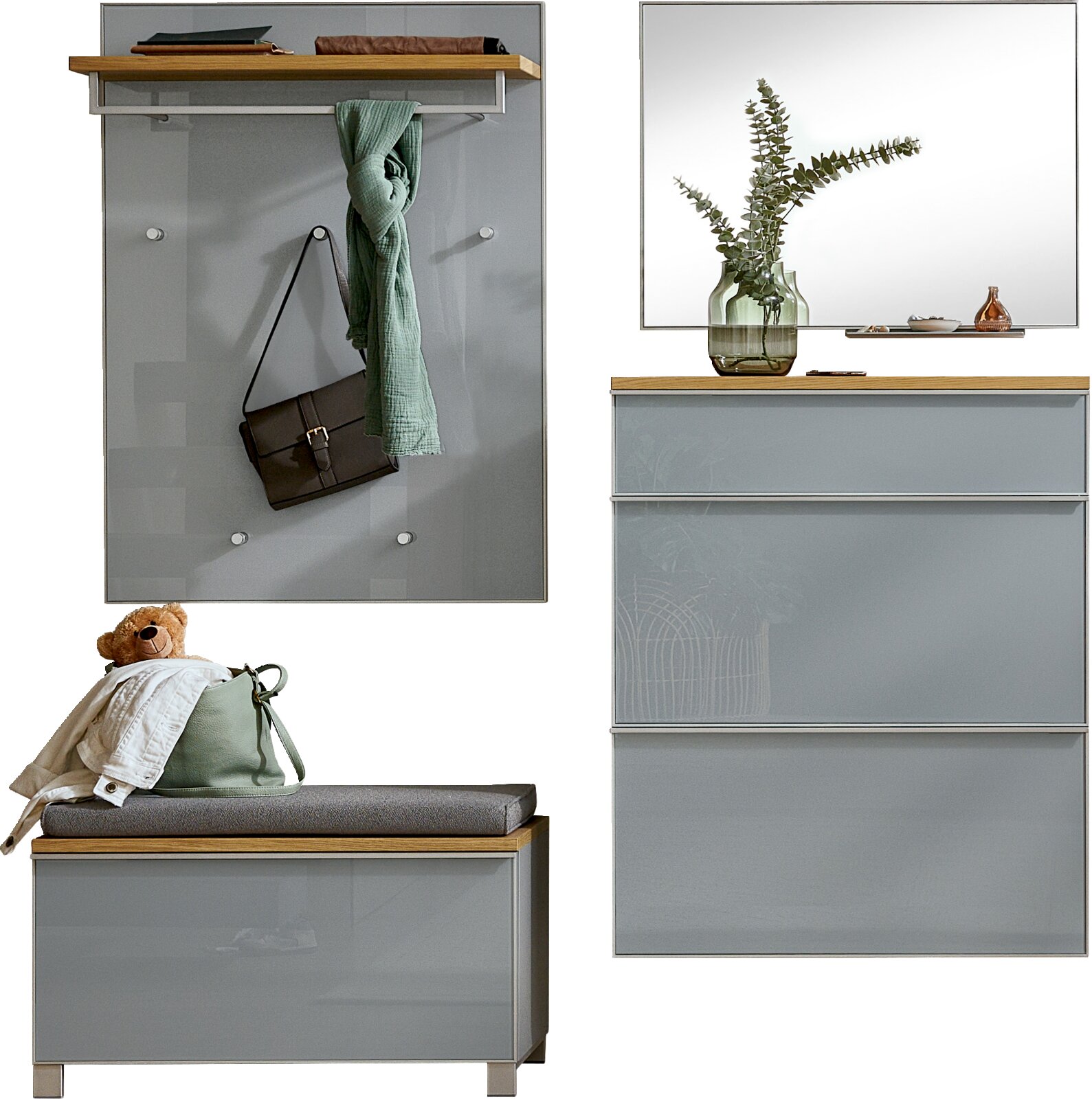 Modernes Garderoben-Set in Grau mit Holzablagen: Wandpaneel mit Haken, Sitzbank und Schuhschrank mit Spiegel, frontal aus leicht seitlicher Perspektive dargestellt.