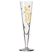 Champagn glas met gouden en zwarte bloemmotieven, zijaanzicht