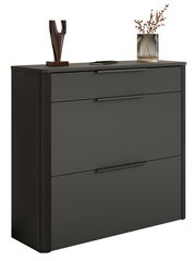 Moderner schwarzer Schuhschrank mit drei Schubladen, dekoriert mit einer Skulptur und einer Vase, seitliche Perspektive