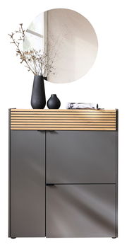 Garderoben-Set in Graphit mit Holzdetails, bestehend aus einem Schrank mit zwei Türen und einer Schublade, dekoriert mit Vasen und einem runden Spiegel, frontal betrachtet.