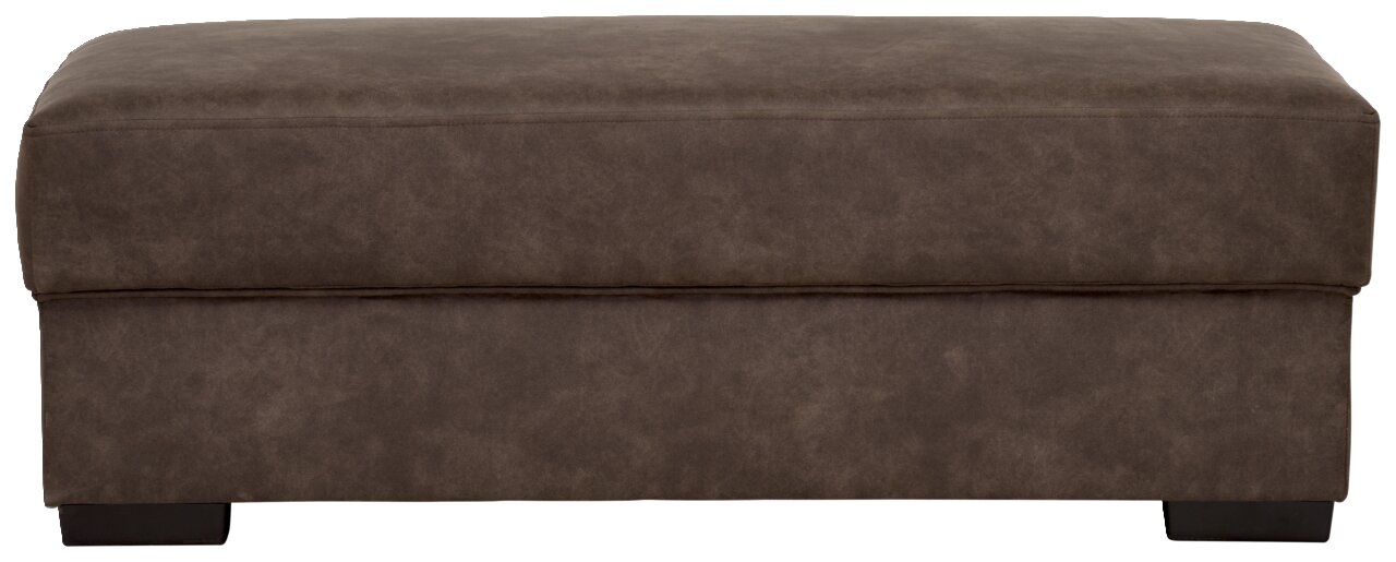 Brauner Hocker in rechteckiger Form, frontal fotografiert.