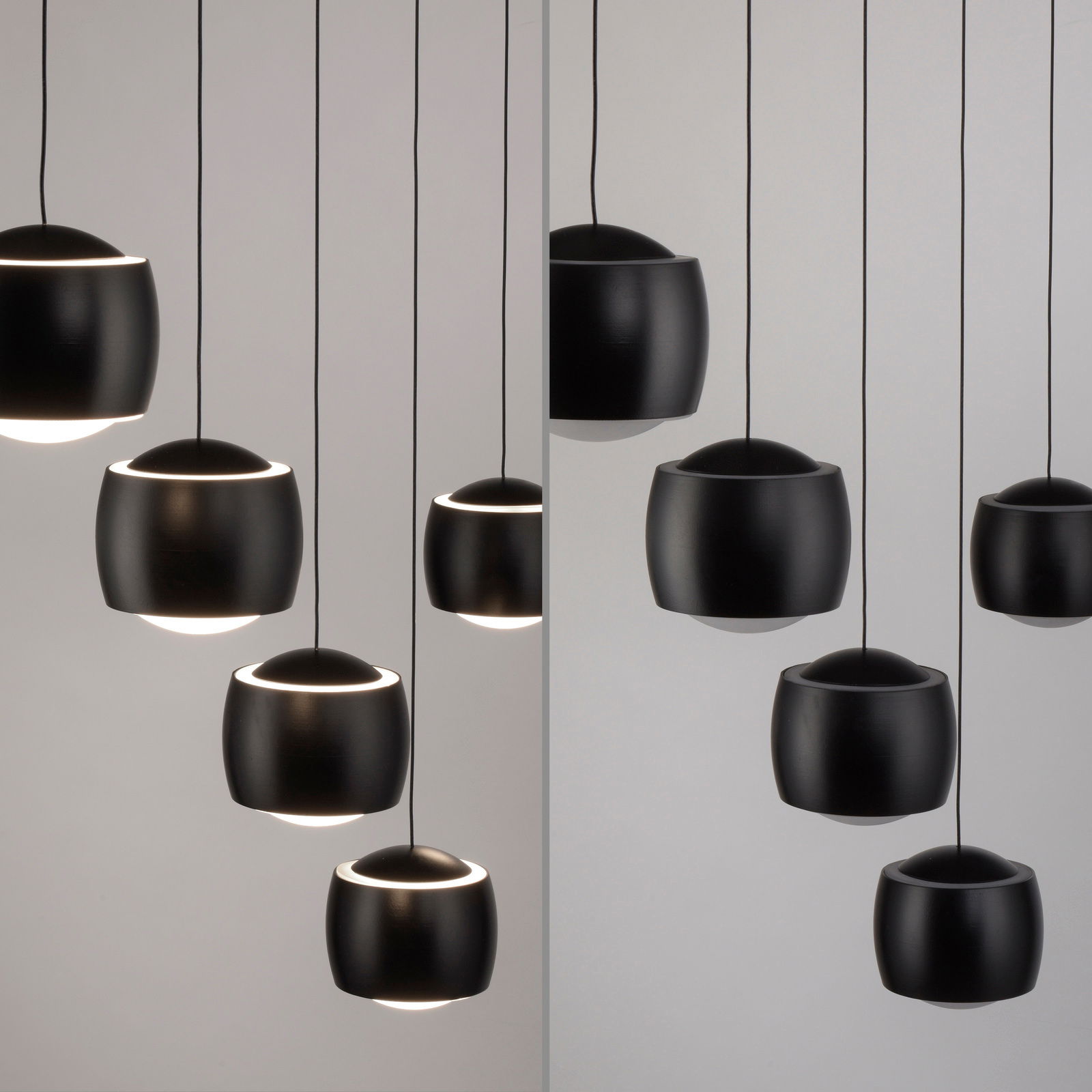 Moderne schwarze Pendelleuchte BALLINI in seitlicher Perspektive, bestehend aus mehreren kugelförmigen Lampenschirmen, die von der Decke hängen.