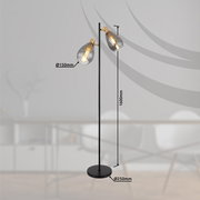 Moderne Stehleuchte mit zwei Glühbirnen, schwarzem Ständer und runder Basis, seitliche Perspektive.