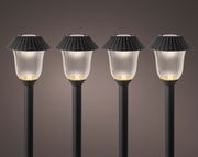 Vier Solar Stabbeleuchten in einer frontalen Ansicht, mit schwarzem Schirm und leuchtendem Licht.