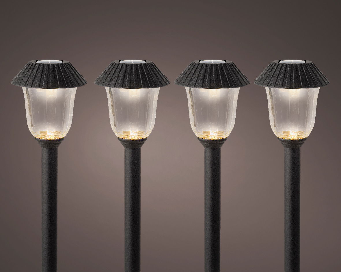 Vier Solar Stabbeleuchten in einer frontalen Ansicht, mit schwarzem Schirm und leuchtendem Licht.