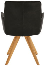 Rückansicht eines schwarzen Design-Schalensessels mit Holzbeinen.