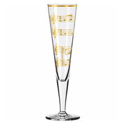 Champagnerglas mit goldenen Notenlinien, seitliche Perspektive