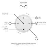 Nahaufnahme eines runden Steuerungselements für die Pendelleuchte PURE E-Loop mit Funktionen zur Anpassung von Höhe, Helligkeit und Farbtemperatur. Perspektive von oben.