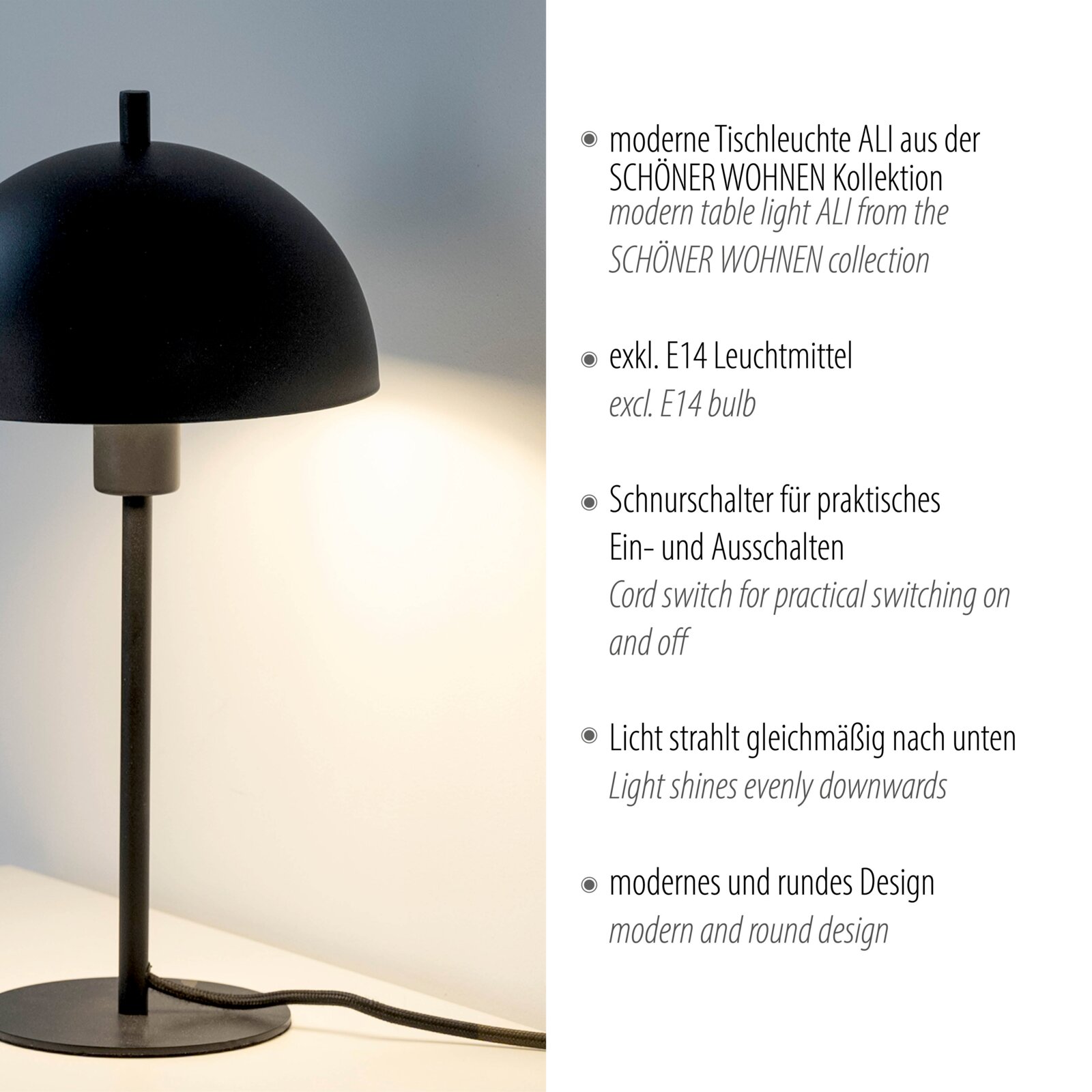 Moderne schwarze Tischleuchte mit halbrundem Schirm und rundem Standfuß, leuchtet warm nach unten; seitliche Ansicht in Nahaufnahme vor hellem Hintergrund.