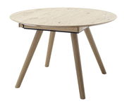 Runder Esstisch aus Holz mit vier schrägen Beinen, seitliche Perspektive