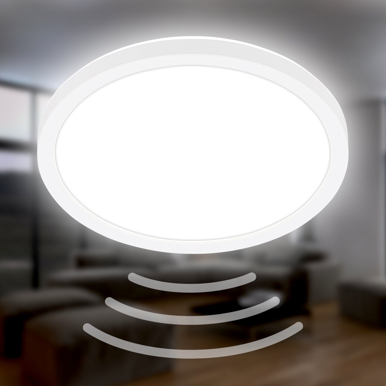 Runde LED-Deckenleuchte mit Bewegungssensor, von unten betrachtet, in einem modernen Wohnraum.