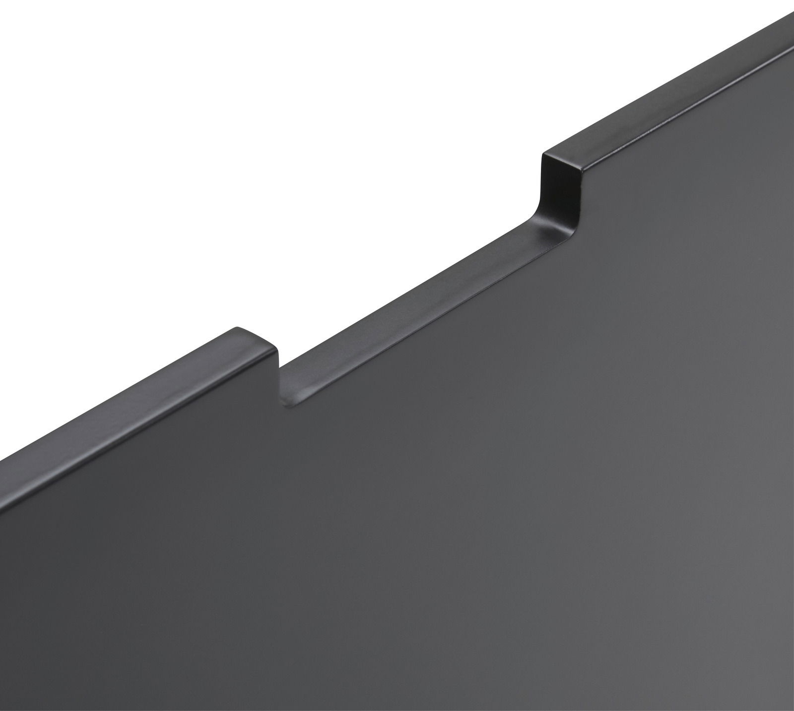 Nahaufnahme einer schwarzen, glatten Kante eines Highboards aus der Vogelperspektive.