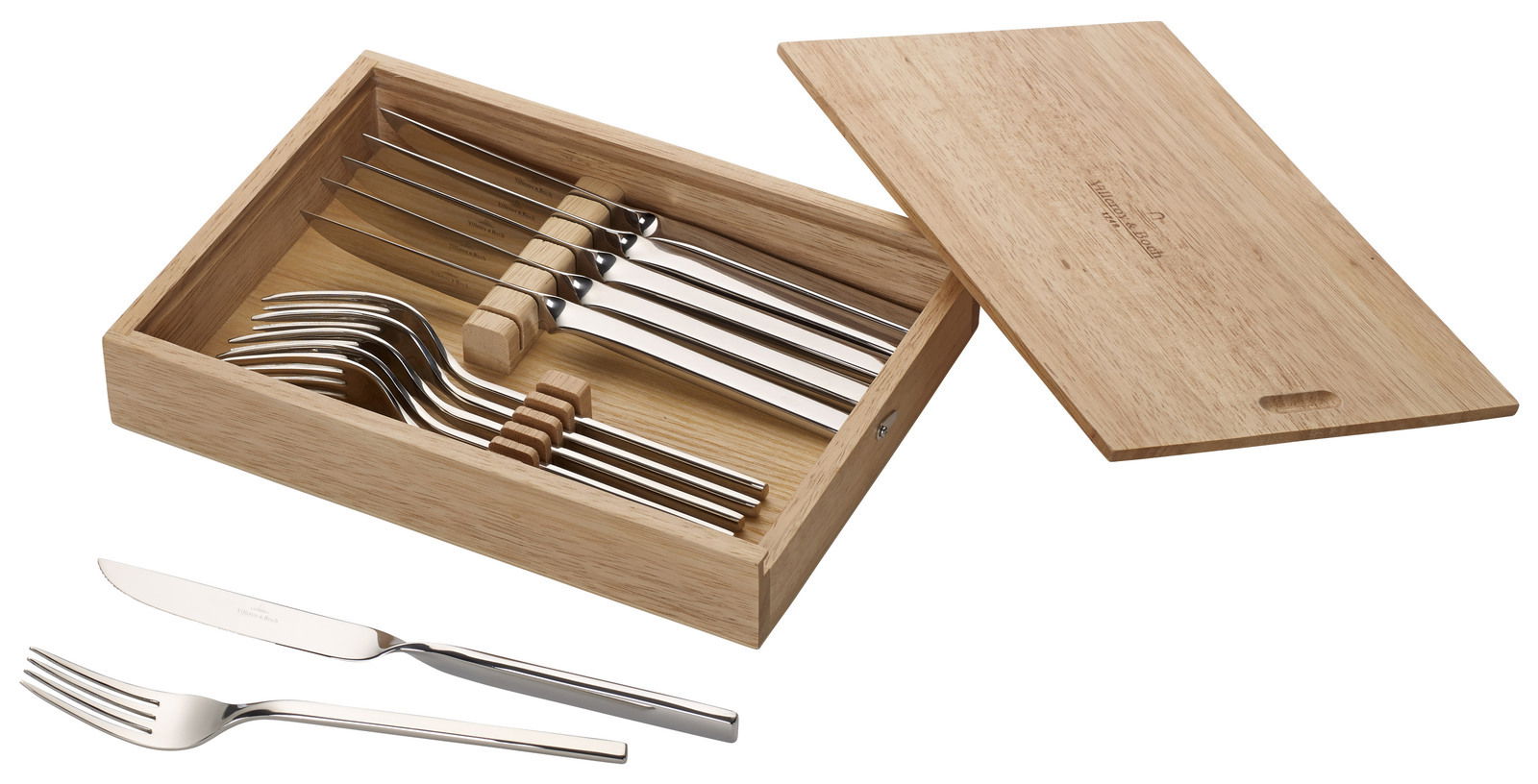Steakbesteck-Set New Wave 12-teilig in einer offenen Holzbox, bestehend aus Messern und Gabeln, aus der Vogelperspektive fotografiert.