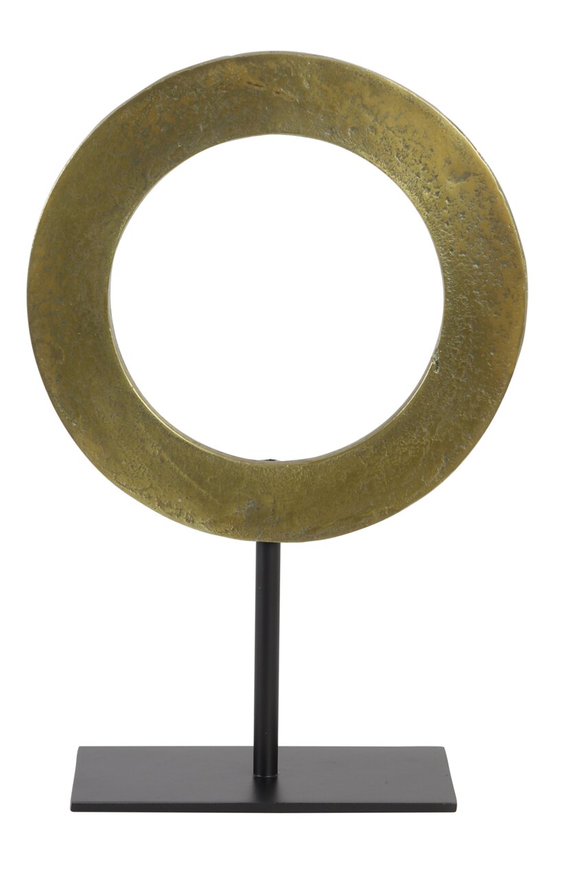 Rundes, goldenes Ornament auf einem schwarzen Ständer, frontal betrachtet.