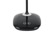 Nahaufnahme der Basis einer LED-Schreibtischleuchte mit Touch-Bedienelementen, von oben betrachtet.