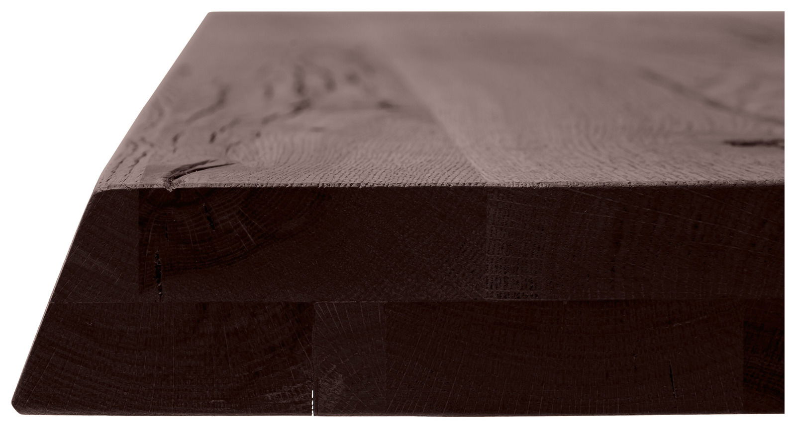 Nahaufnahme einer massiven Tischplatte aus dunklem Holz, seitliche Perspektive