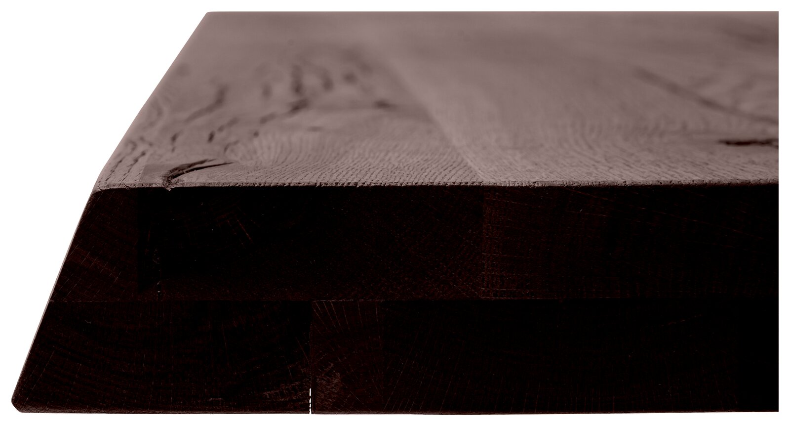 Nahaufnahme einer massiven Tischplatte aus dunklem Holz, seitliche Perspektive