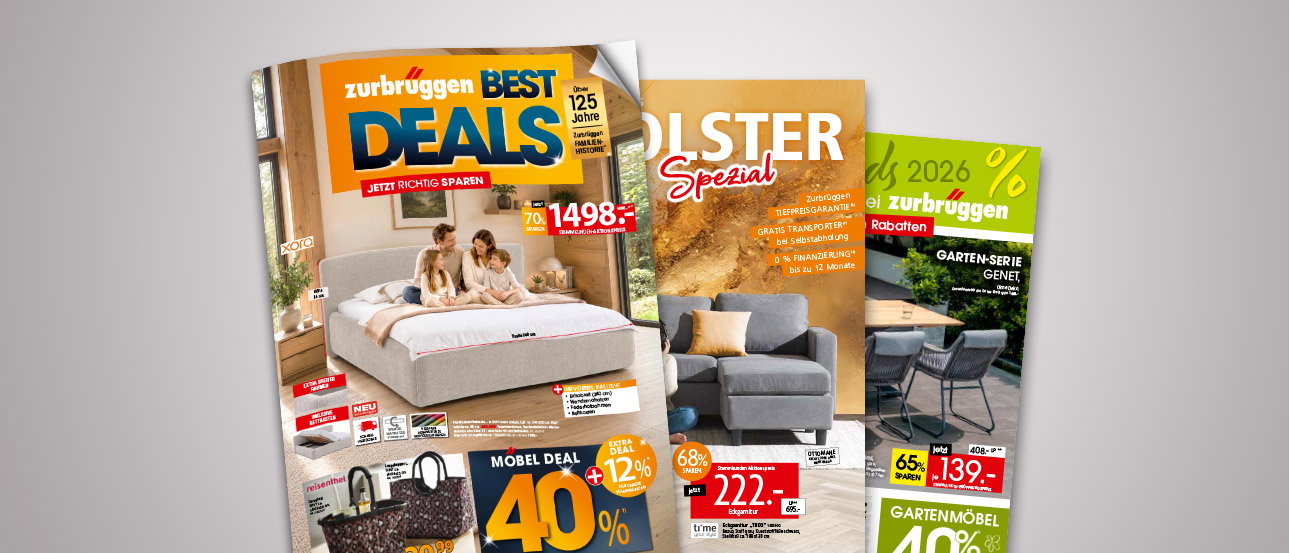 Smartphone mit digitalem Zurbrüggen-Prospekt „Best Deals“ mit Bett und Rabattangeboten, weitere Prospekte im Hintergrund.