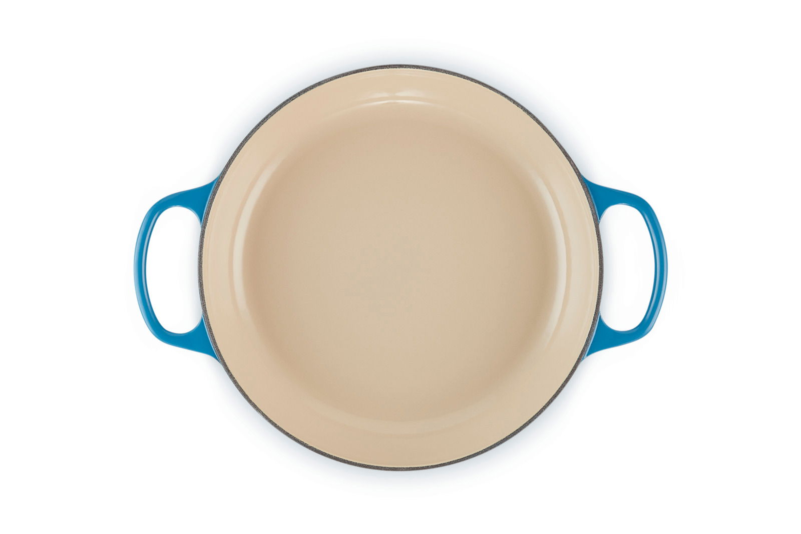 Runde, cremefarbene Auflaufform mit blauen Griffen, Ansicht von oben