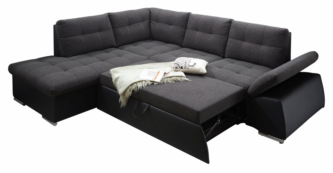 Dunkelgraue Rundecke mit ausziehbarem Bett, dekoriert mit Kissen und Decke, Perspektive von schräg oben.