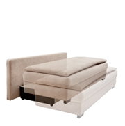 Beige functionele bank in zijaanzicht, gedeeltelijk uitgeschoven.