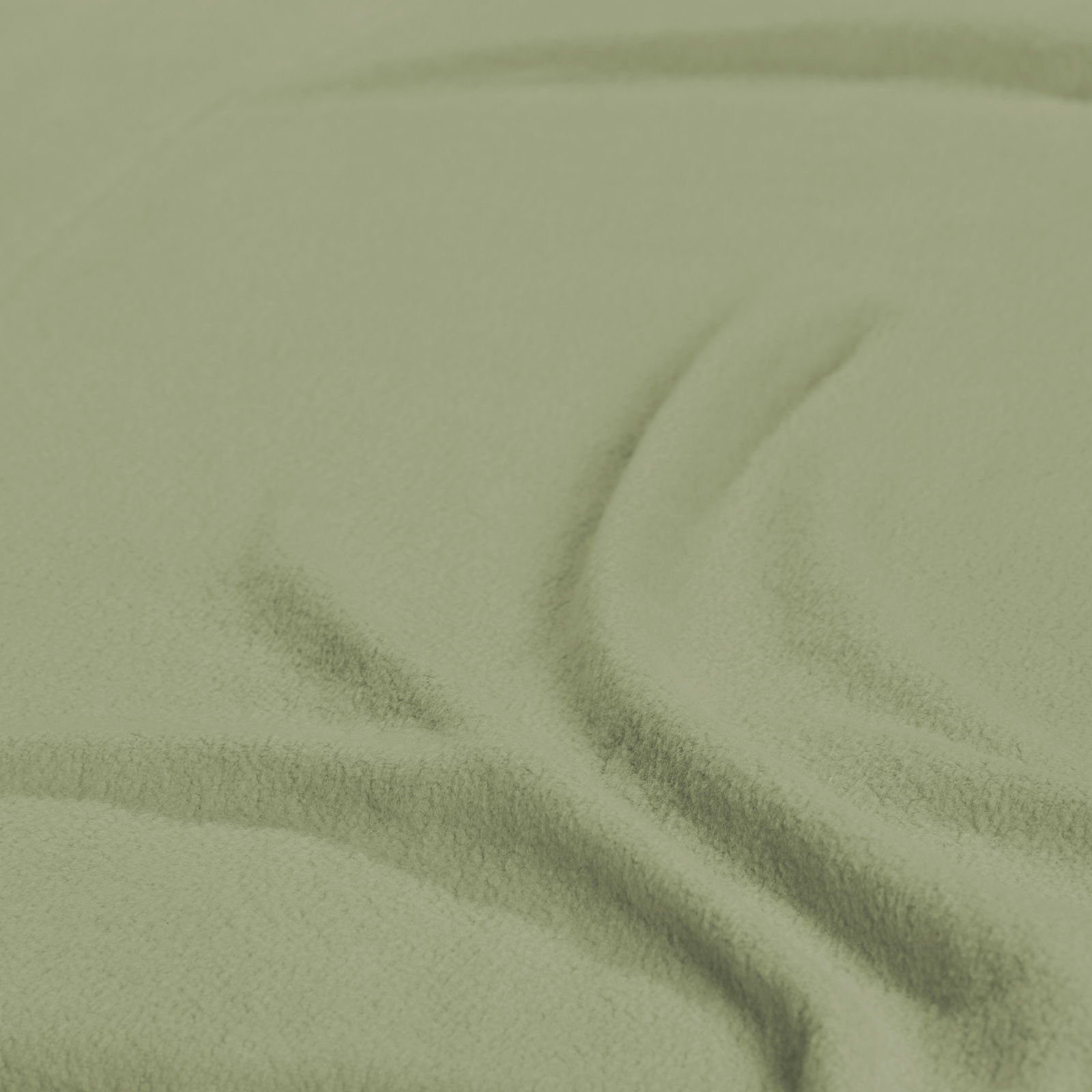 Nahaufnahme eines grünen Spannbetttuchs mit weicher Textur, von oben betrachtet.
