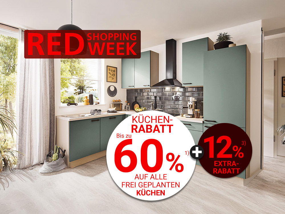 Moderne grüne Einbauküche mit schwarzen Akzenten, Tageslicht und rotem Schriftzug „Red Shopping Week