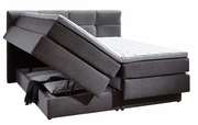 Boxspringbett mit geöffnetem Stauraum, seitliche Perspektive