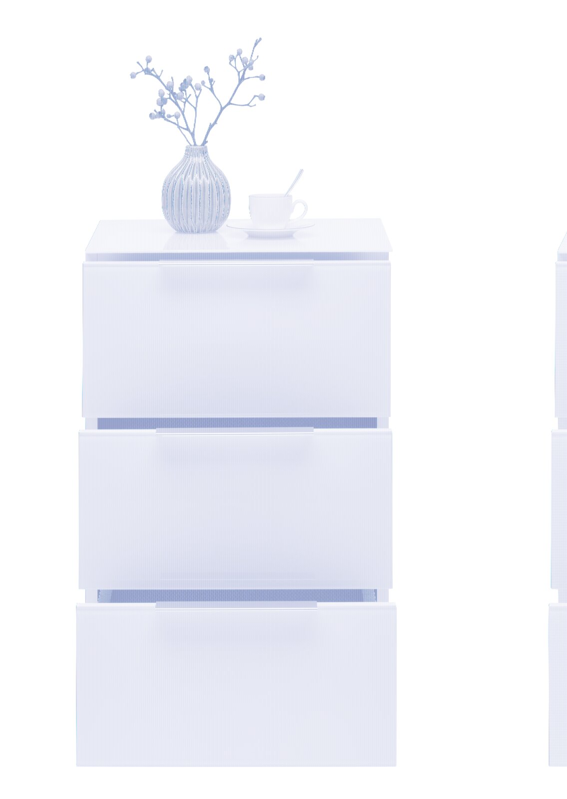 Weiße Nachtkonsole mit drei Schubladen, darauf eine grüne Vase mit Zweigen und eine weiße Tasse mit Löffel, frontale Ansicht.