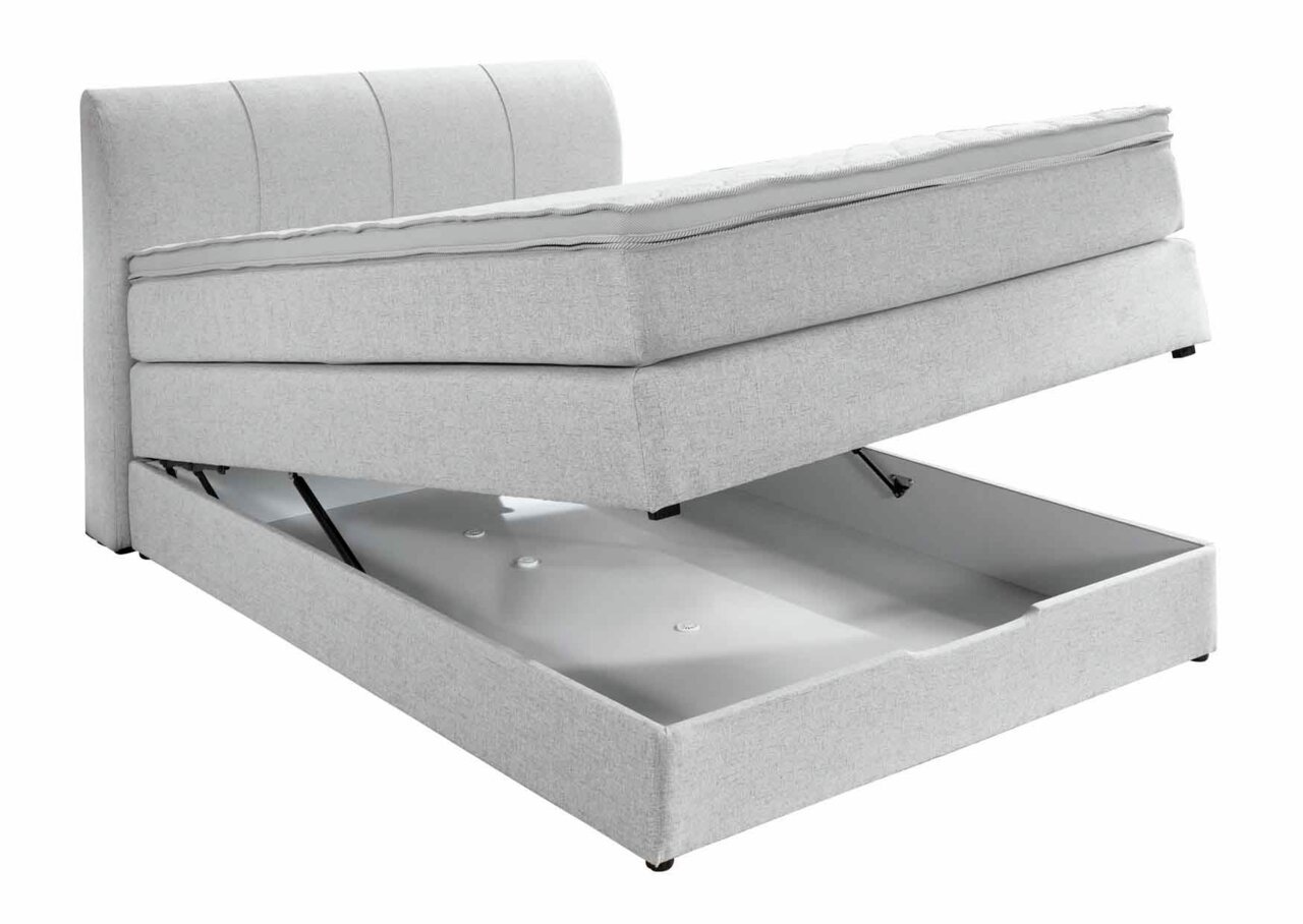Boxspringbett mit geöffnetem Stauraum, seitliche Perspektive