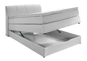 Boxspringbett mit geöffnetem Stauraum, seitliche Perspektive