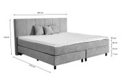 Graues Boxspringbett mit Kopfteil, seitliche Perspektive, Maße: 205 cm Breite, 215 cm Länge, 120 cm Höhe