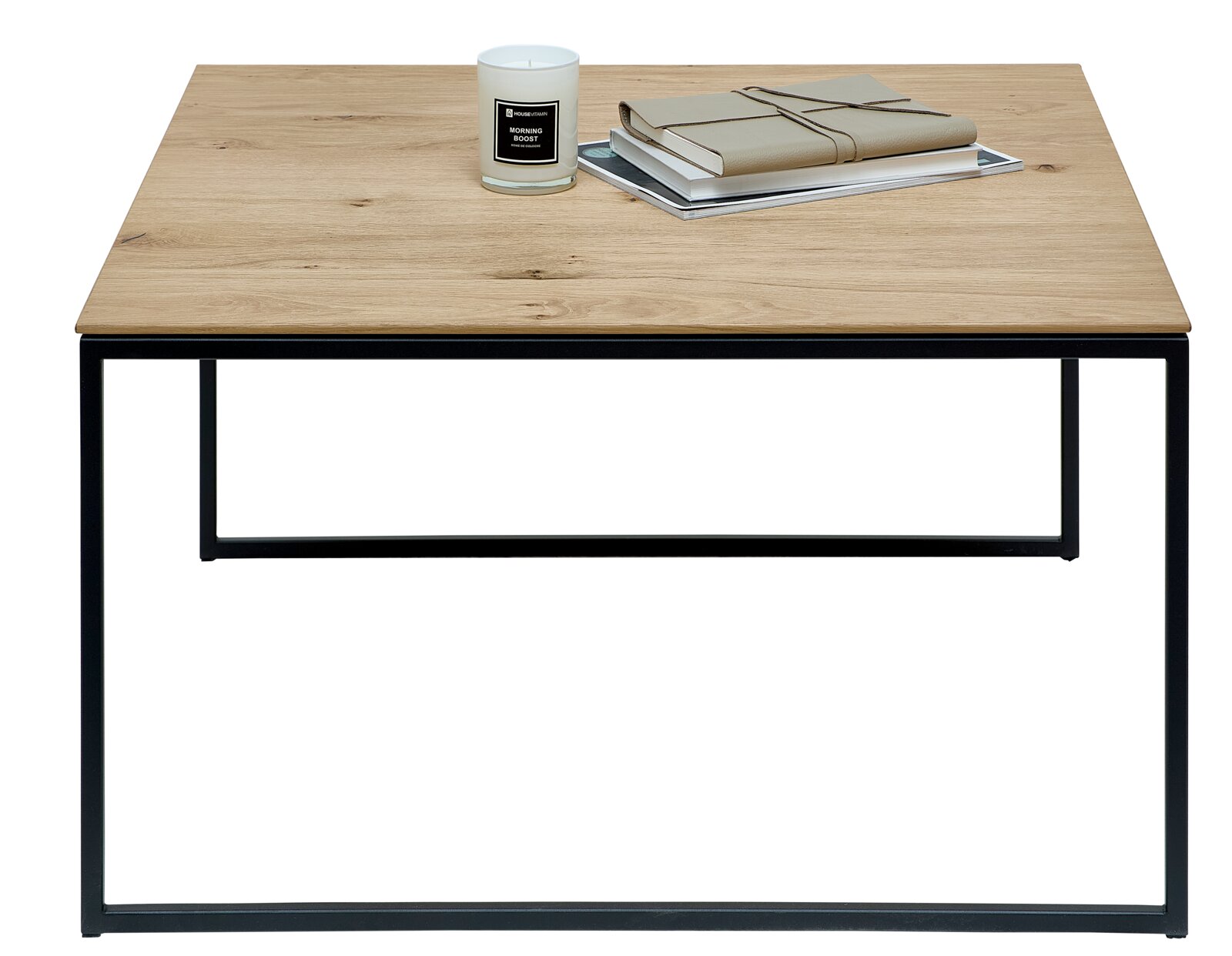 Moderne bijzettafel met houten blad en zwart metalen onderstel, gefotografeerd van voren. Op de tafel staan een kaars en boeken.