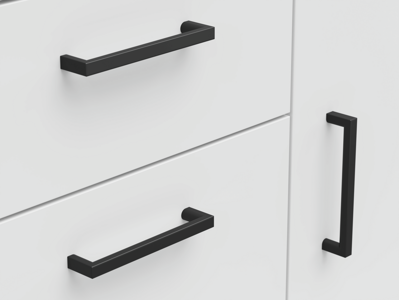 Nahaufnahme einer weißen Kommode mit schwarzen Griffen, seitliche Perspektive