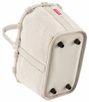 Kleine, beige Tragetasche mit weichem, flauschigem Material und stabilen Griffen, von unten betrachtet.