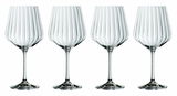 Vier elegante Gin Tonic Gläser mit geriffeltem Design, frontal abgebildet.