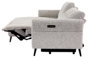 Zijaanzicht van een grijze hoekbank met verstelbare rugleuning en voetsteun, modern design
