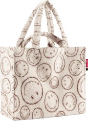 Kuschelige Teddyfell-Shopper-Tasche in Cremeweiß mit braunem Smiley-Muster und zwei Tragehenkeln, Produktansicht schräg von vorne auf weißem Hintergrund