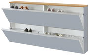 Modernes Schuhkippschrank/Schuhregal mit zwei nach vorne geöffneten Klappen, grauen Fronten und Holzoberplatte, innen Drahtkörbe mit Schuhen; Perspektive: schräg von vorne (3/4-Ansicht)